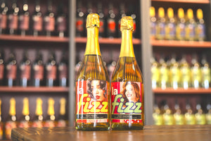 La Fizz Peach and Raspberry in front of Wine Wall at La Mesa Sutter Creek