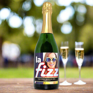 Bottle of La Fizz California Sparkling wine with a colorful label featuring a person's face.