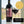 Bottle and glass of La Mesa Vineyards Mourvedre 2021 wine with a gold award label.