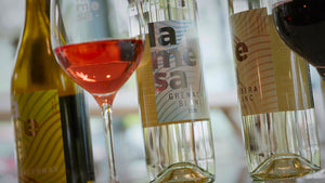 La Mesa wine bottles opened up with a glass of Rosé and Red