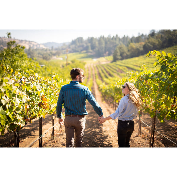 Couple Walking Rows of VInes at La Mesa VIneyards